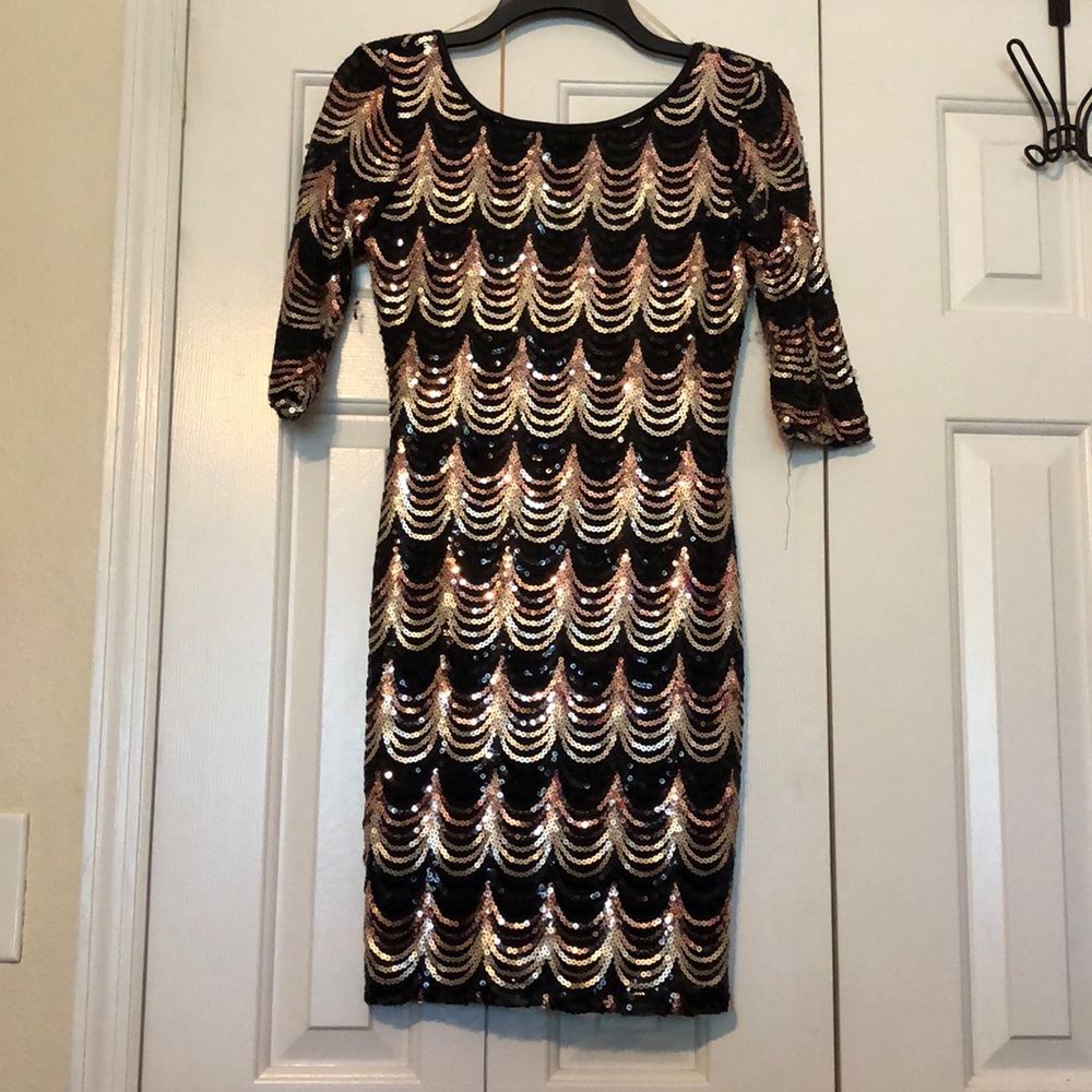 Black and gold body fitting short dress